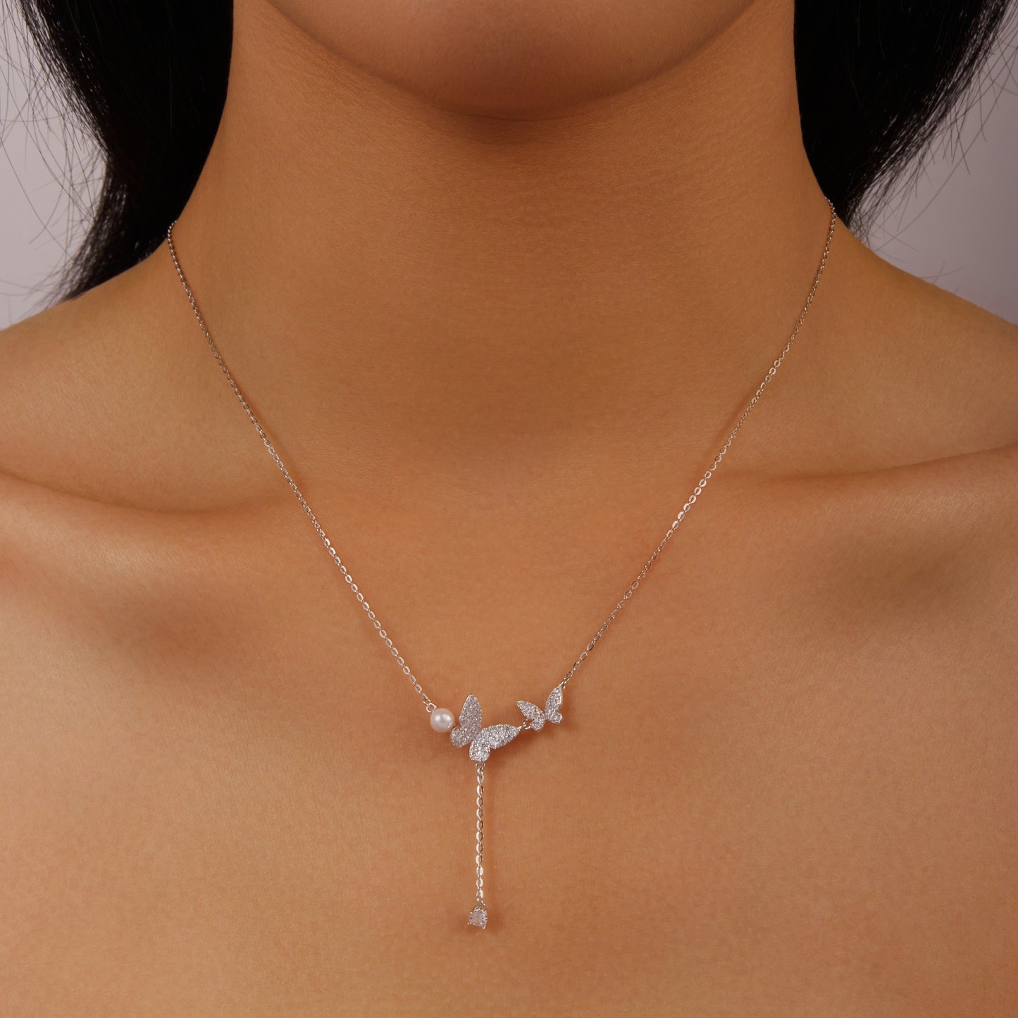 Silver butterfly with small ball