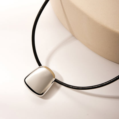 String with silver pendant