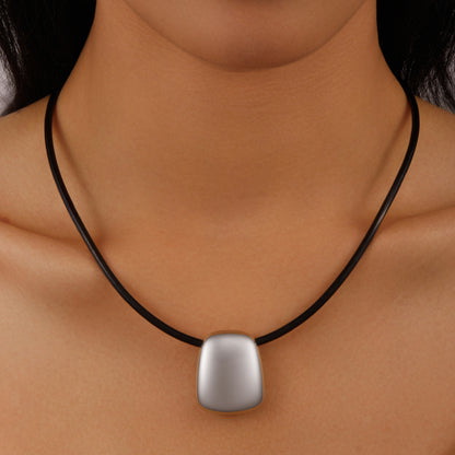String with silver pendant