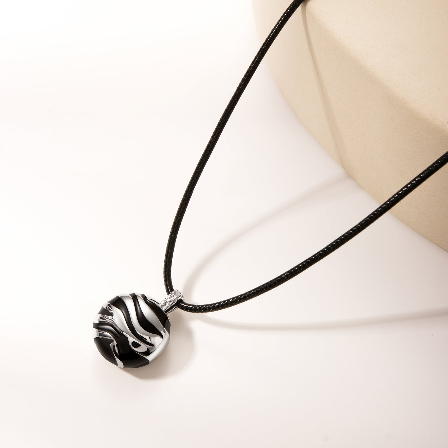 String with silver black pendant
