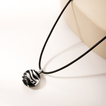 String with silver black pendant
