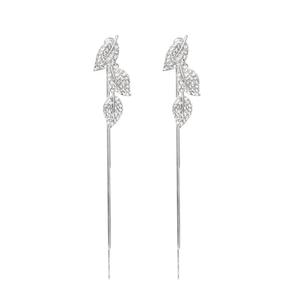 Pair of silver leaf-shaped earrings on a white background