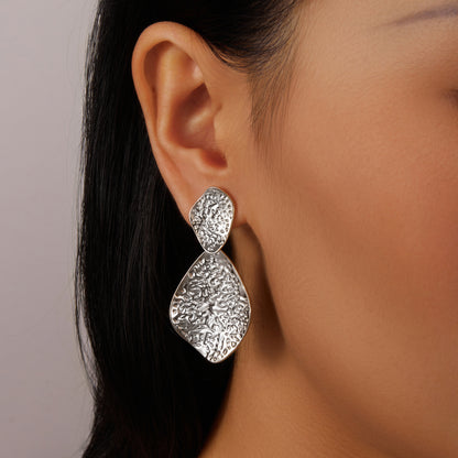 2 silver indented leaves