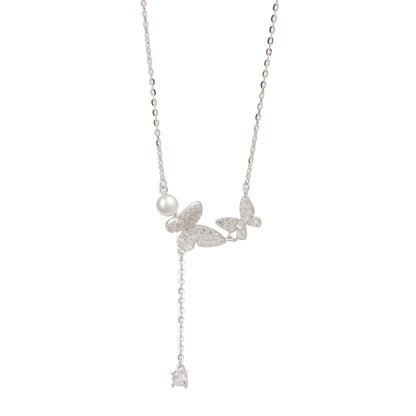 Silver butterfly with small ball
