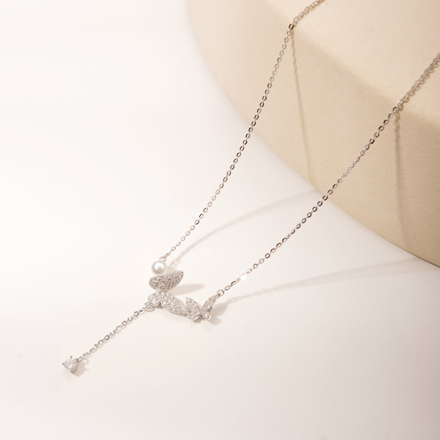 Silver butterfly with small ball
